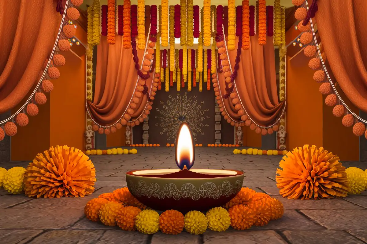 Illuminated clay diya centerpiece surrounded by festive orange and yellow marigold garlands.